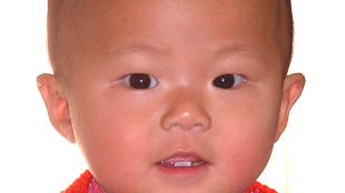 My new Canadian posing for her first Canadian passport photo a few days before leaving China